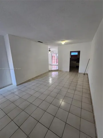 a view of a livingroom and window