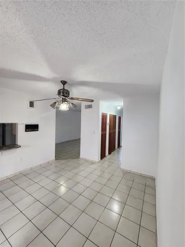 a view of a livingroom with a staircase
