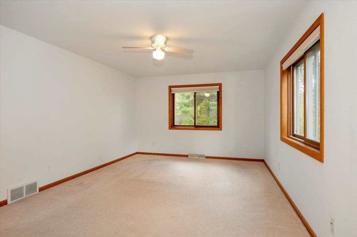 6373 Maple Grove Road Cloquet, MN 55720 - Photo 15 of 42 Unfurnished room featuring carpet and a ceiling fan