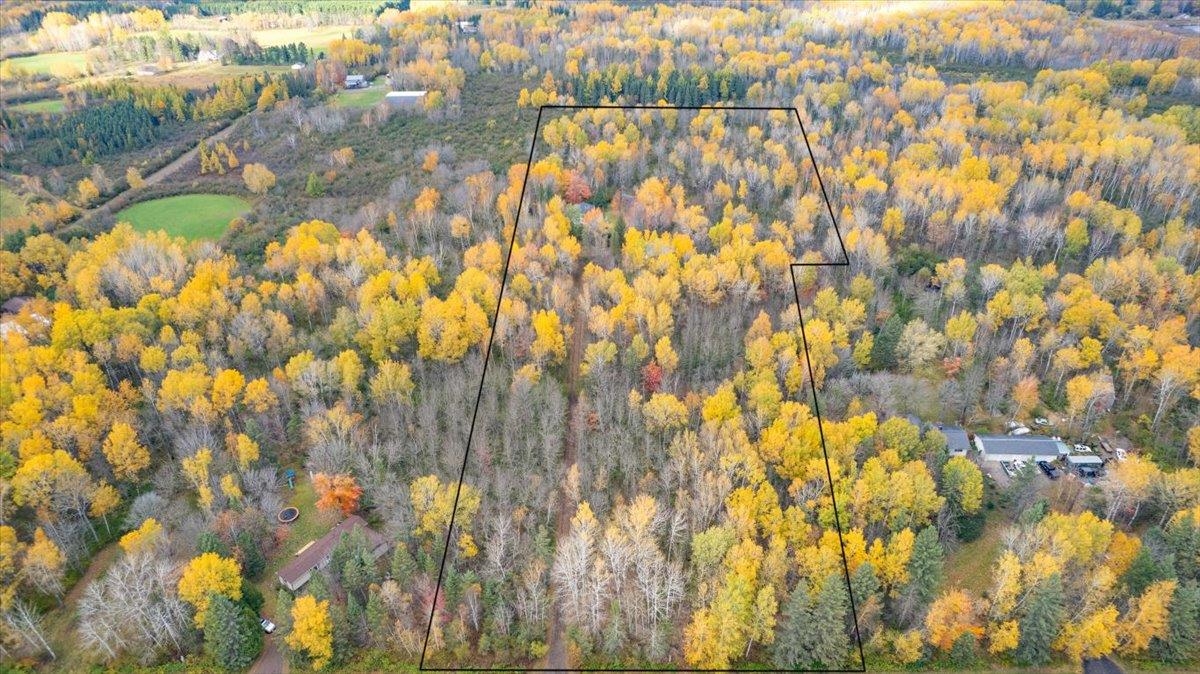 6373 Maple Grove Road Cloquet, MN 55720 - Photo 39 of 42 Aerial view of property and surrounding area featuring a heavily wooded area