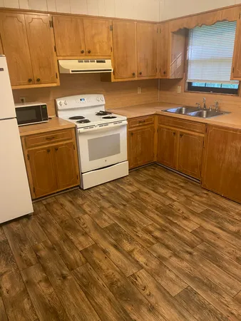 a kitchen with a stove and a sink