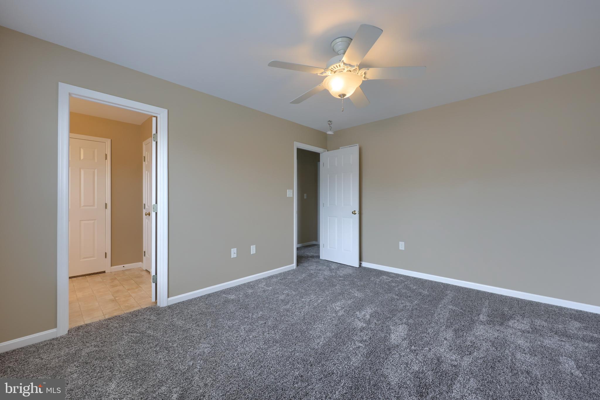 619 Chatham Way Lititz, PA 17543 - Photo 23 of 32 a view of an empty room with a chandelier fan