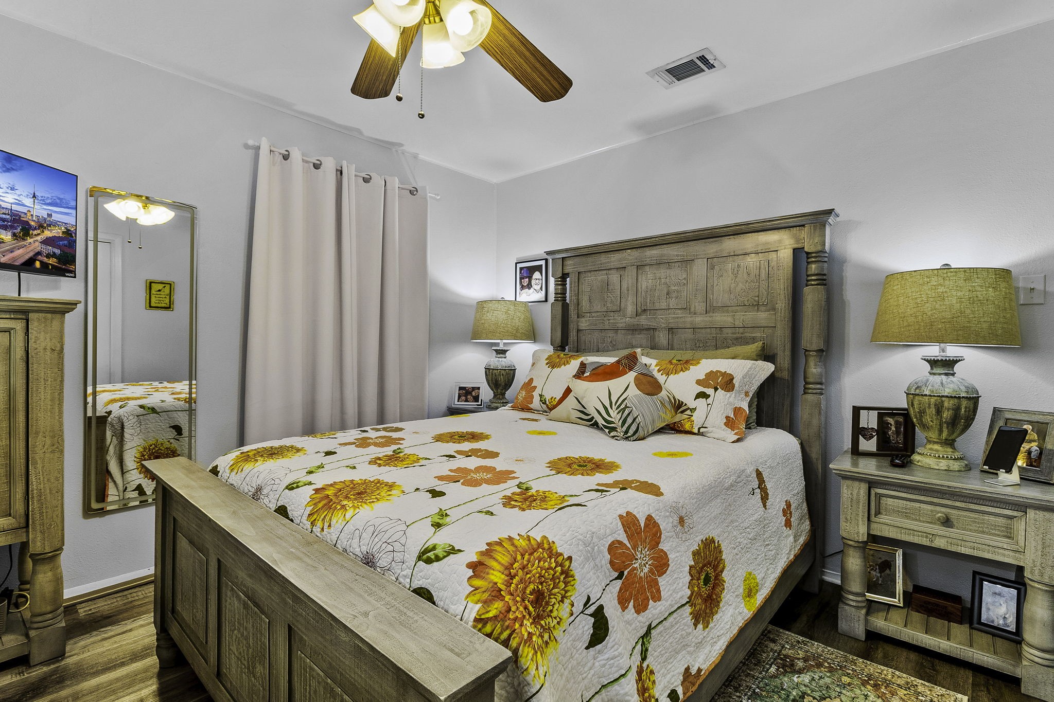 188 Huckleberry Road Onalaska, TX 77360 - Photo 16 of 49 a bedroom with a bed and a chandelier