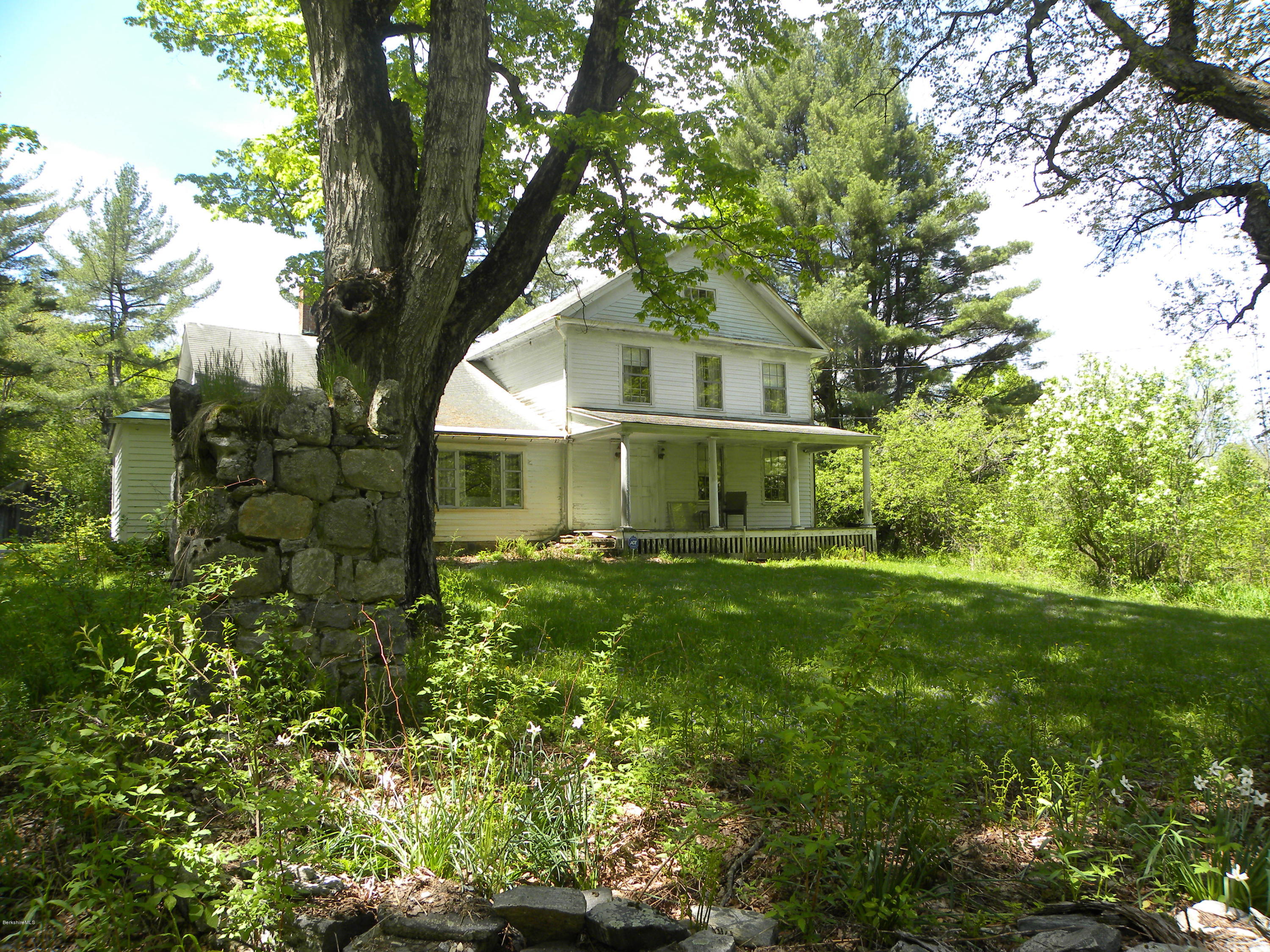 51 Norfolk Road Sandisfield, MA 01255 - Photo 1 of 11 a front view of a house with a garden
