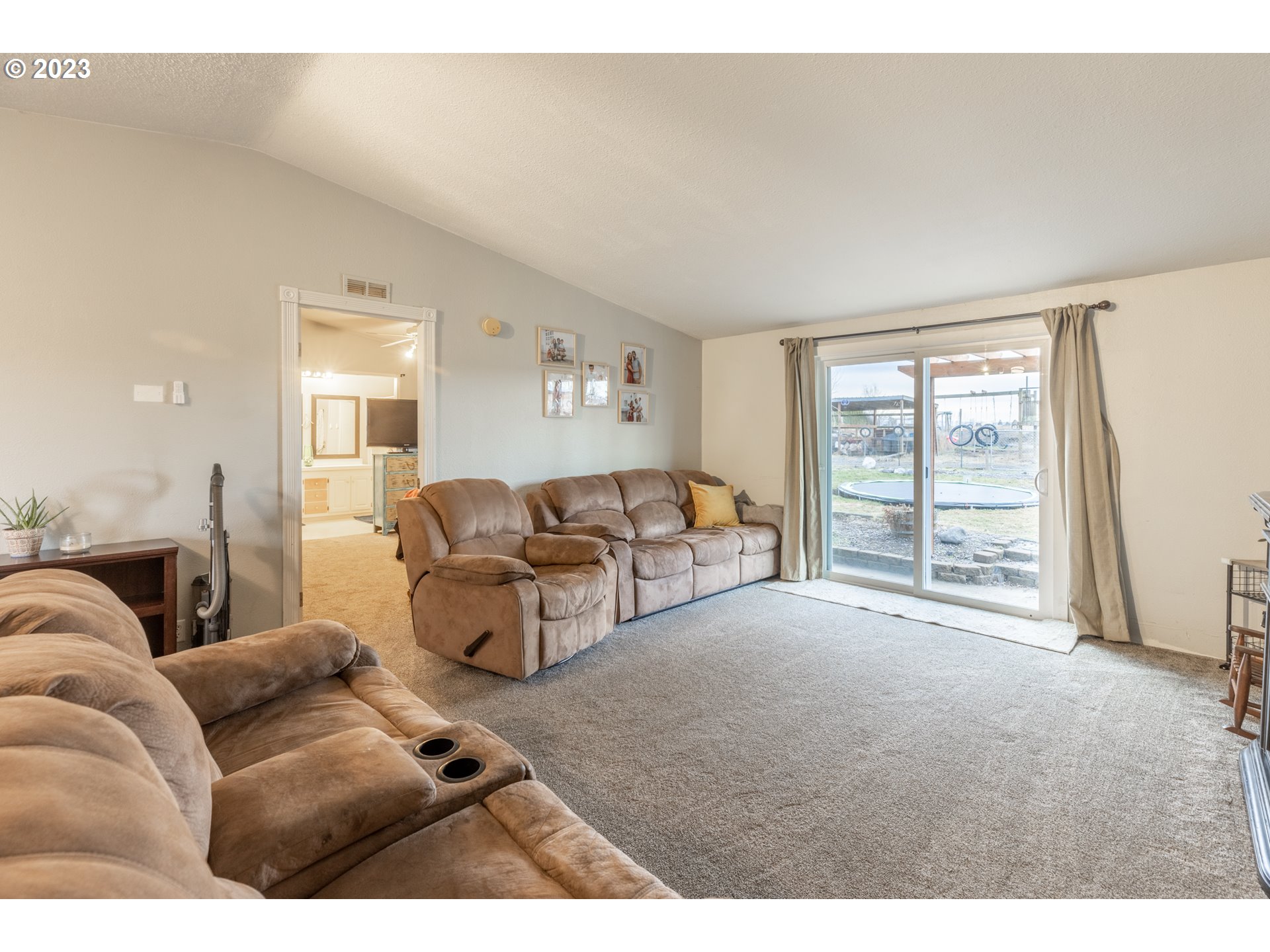 78390 Agnew Road Hermiston, OR 97838 - Photo 19 of 27 a living room with furniture and a large window