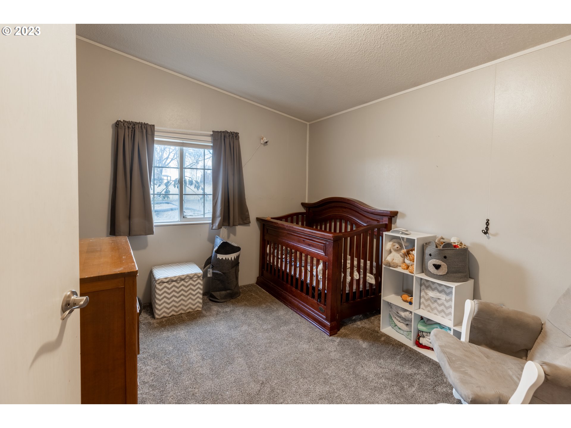 78390 Agnew Road Hermiston, OR 97838 - Photo 20 of 27 a bedroom with furniture and a window