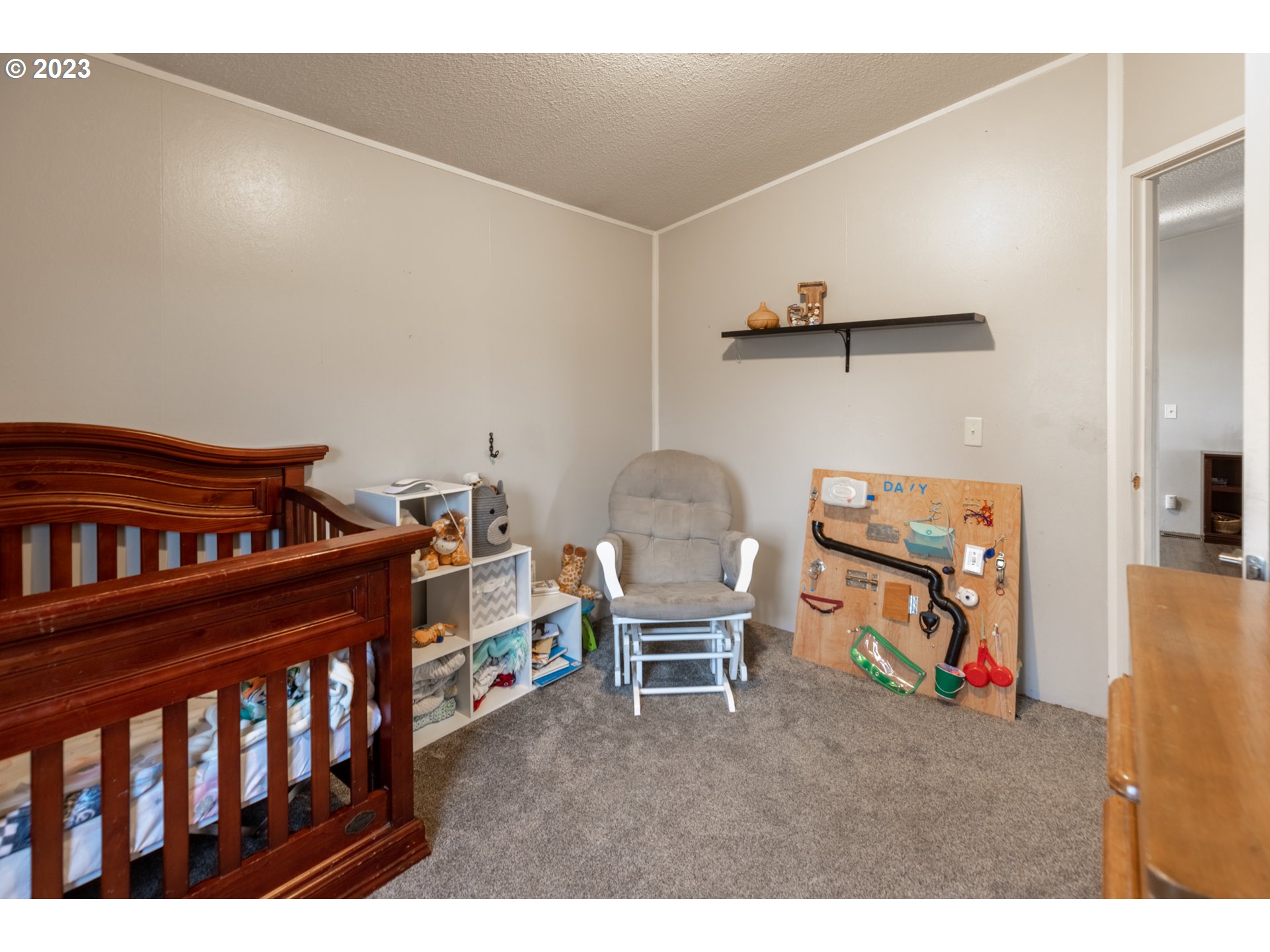 78390 Agnew Road Hermiston, OR 97838 - Photo 21 of 27 a bedroom with furniture and a baby crib