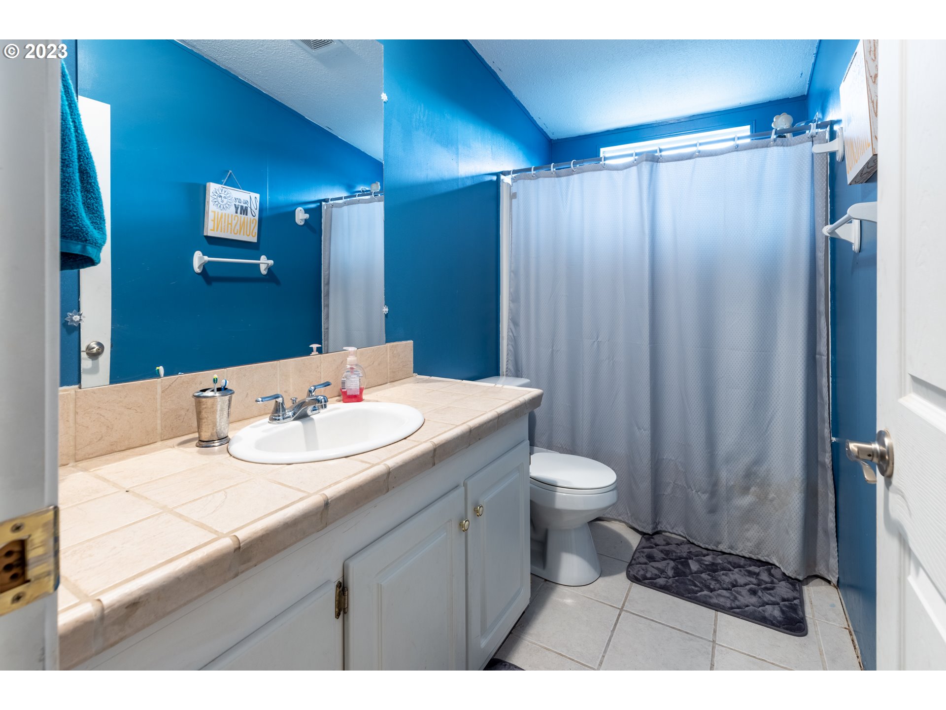 78390 Agnew Road Hermiston, OR 97838 - Photo 23 of 27 a bathroom with a double vanity sink toilet and a mirror