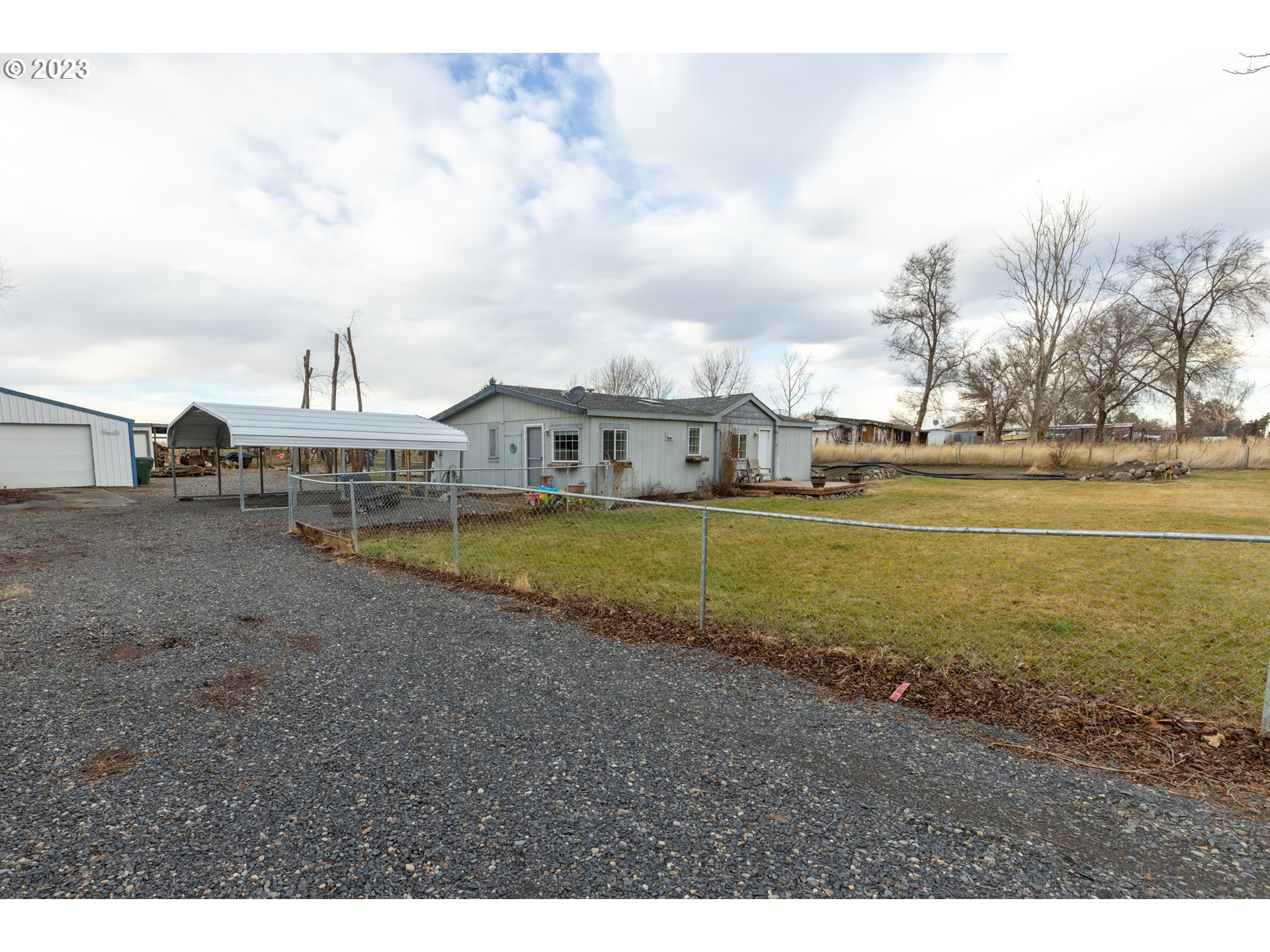 78390 Agnew Road Hermiston, OR 97838 - Photo 3 of 27 a view of a house with yard and sitting area