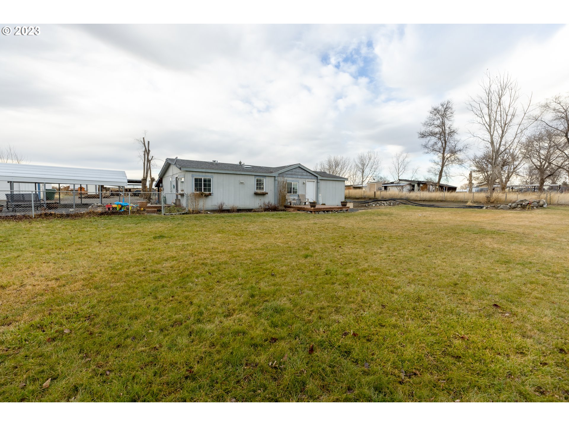 78390 Agnew Road Hermiston, OR 97838 - Photo 6 of 27 a view of a ocean with boats and trees in the background