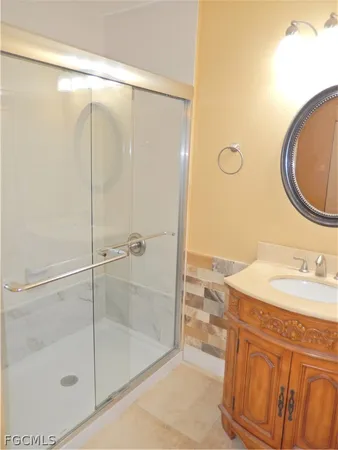 a bathroom with a sink and a mirror