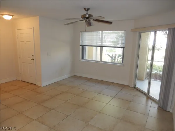 a view of an empty room and window