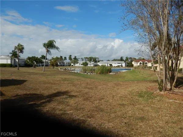 a front view of a house with a garden and patio