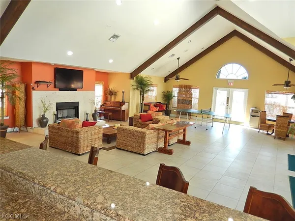 a kitchen with granite countertop a refrigerator and a sink
