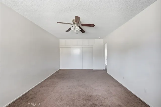 a view of a ceiling fan in a room