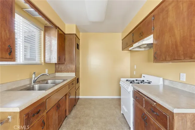 a kitchen with a sink and a cabinets