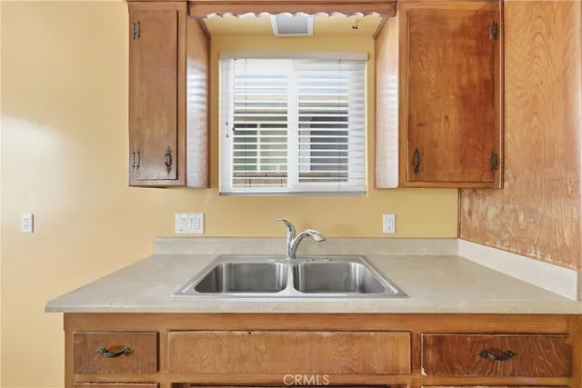 a kitchen with a sink and cabinets