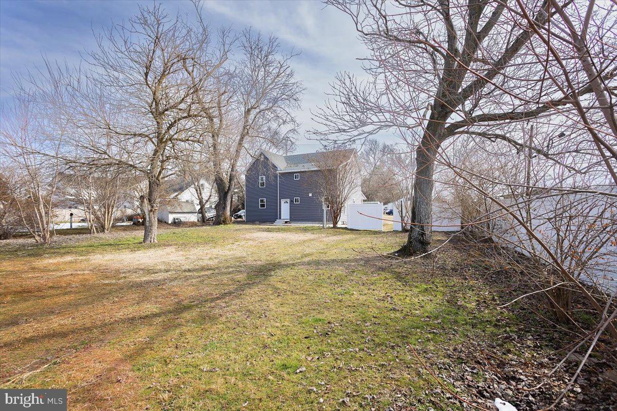 5026 Bethlehem Road Preston, MD 21655 - Photo 7 of 25 a view of a yard with a tree
