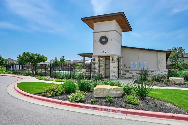 a view of a swimming pool and lounge chairs