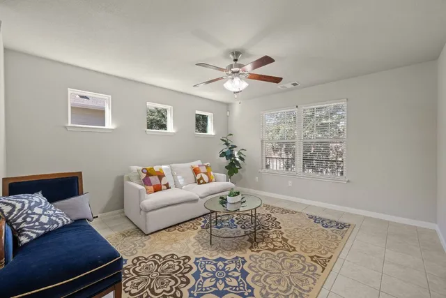 a living room with furniture and a window