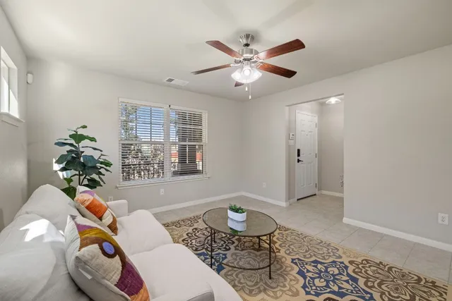 a living room with furniture and window