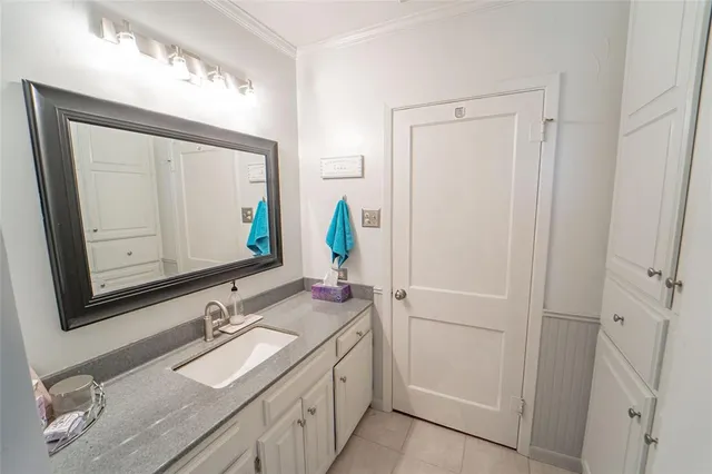 a bathroom with a granite countertop sink mirror and double
