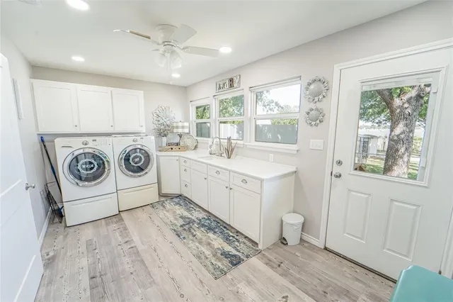 a view of a livingroom with a fireplace and window
