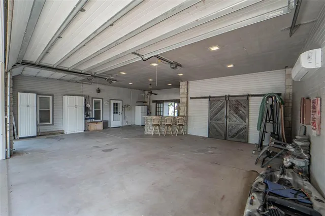 a view of a house with backyard porch and sitting area