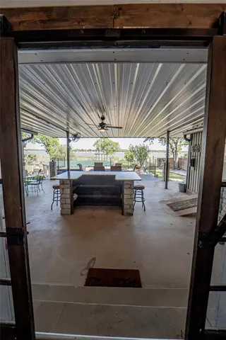 a living room with furniture and a ceiling fan