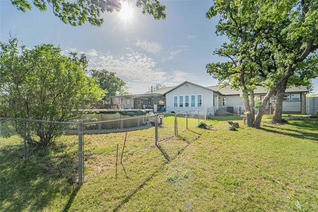 a view of swimming pool with a yard