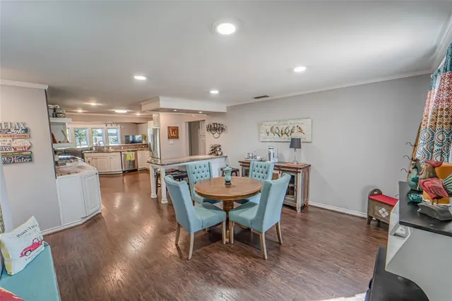 a bedroom with two beds and a lamp