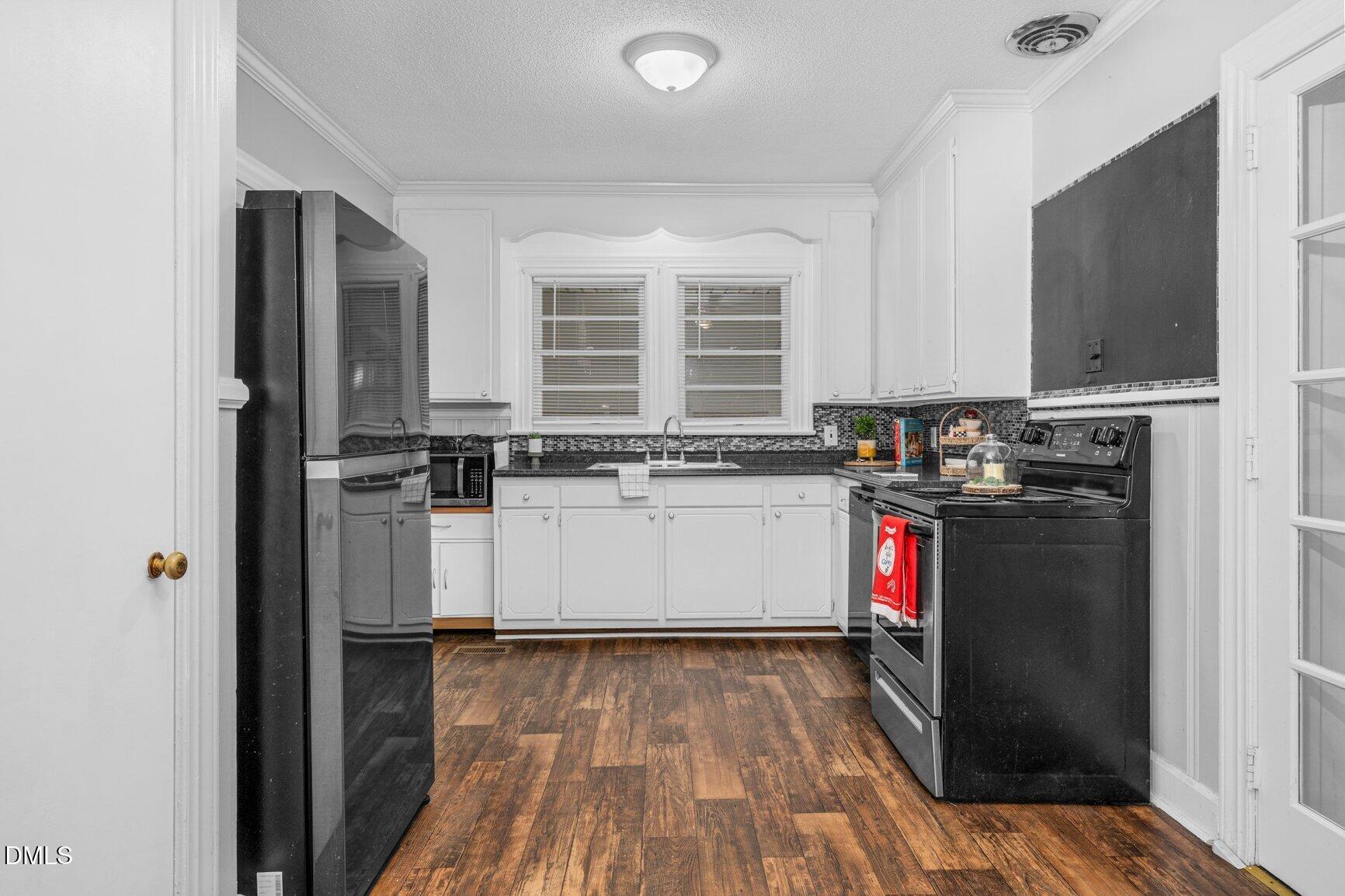 902 Treemont Road Northwest Wilson, NC 27896 - Photo 12 of 43 a kitchen with a refrigerator and window