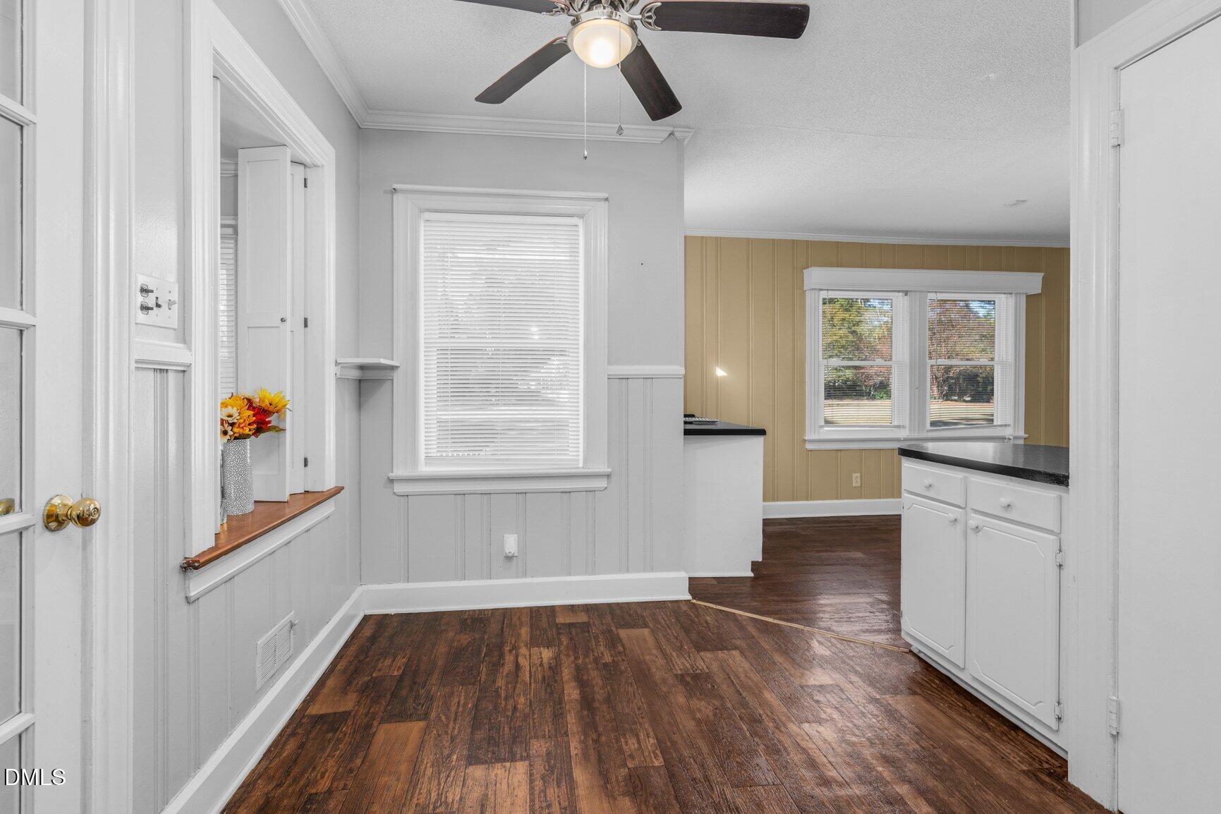 902 Treemont Road Northwest Wilson, NC 27896 - Photo 13 of 43 a view of empty room with wooden floor and fan