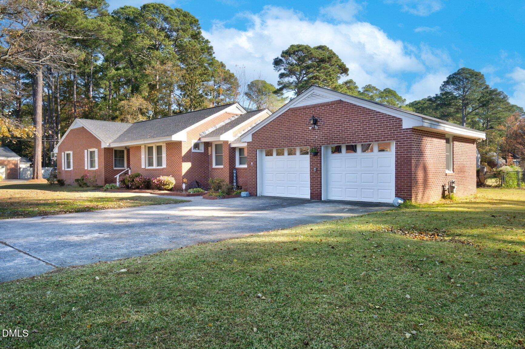 902 Treemont Road Northwest Wilson, NC 27896 - Photo 2 of 43 a house view with a garden space