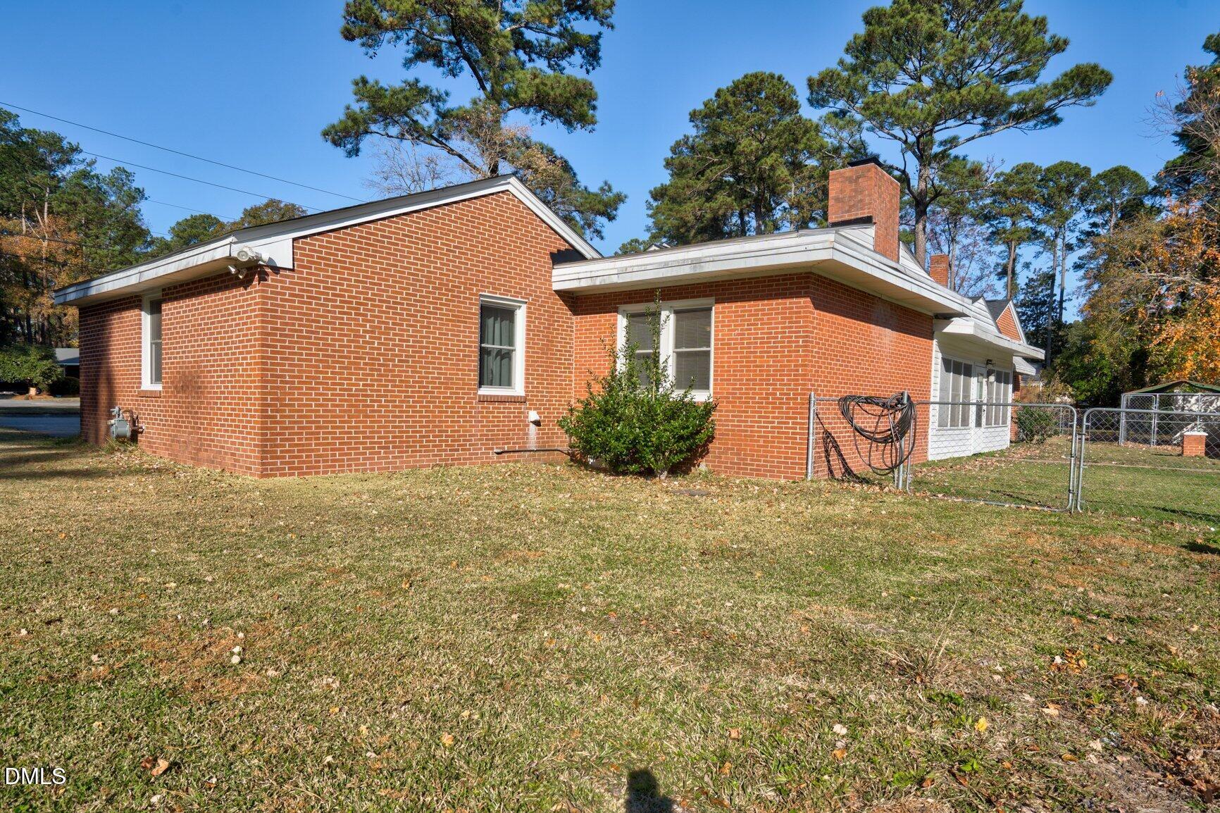 902 Treemont Road Northwest Wilson, NC 27896 - Photo 39 of 43 a house with trees in front of it