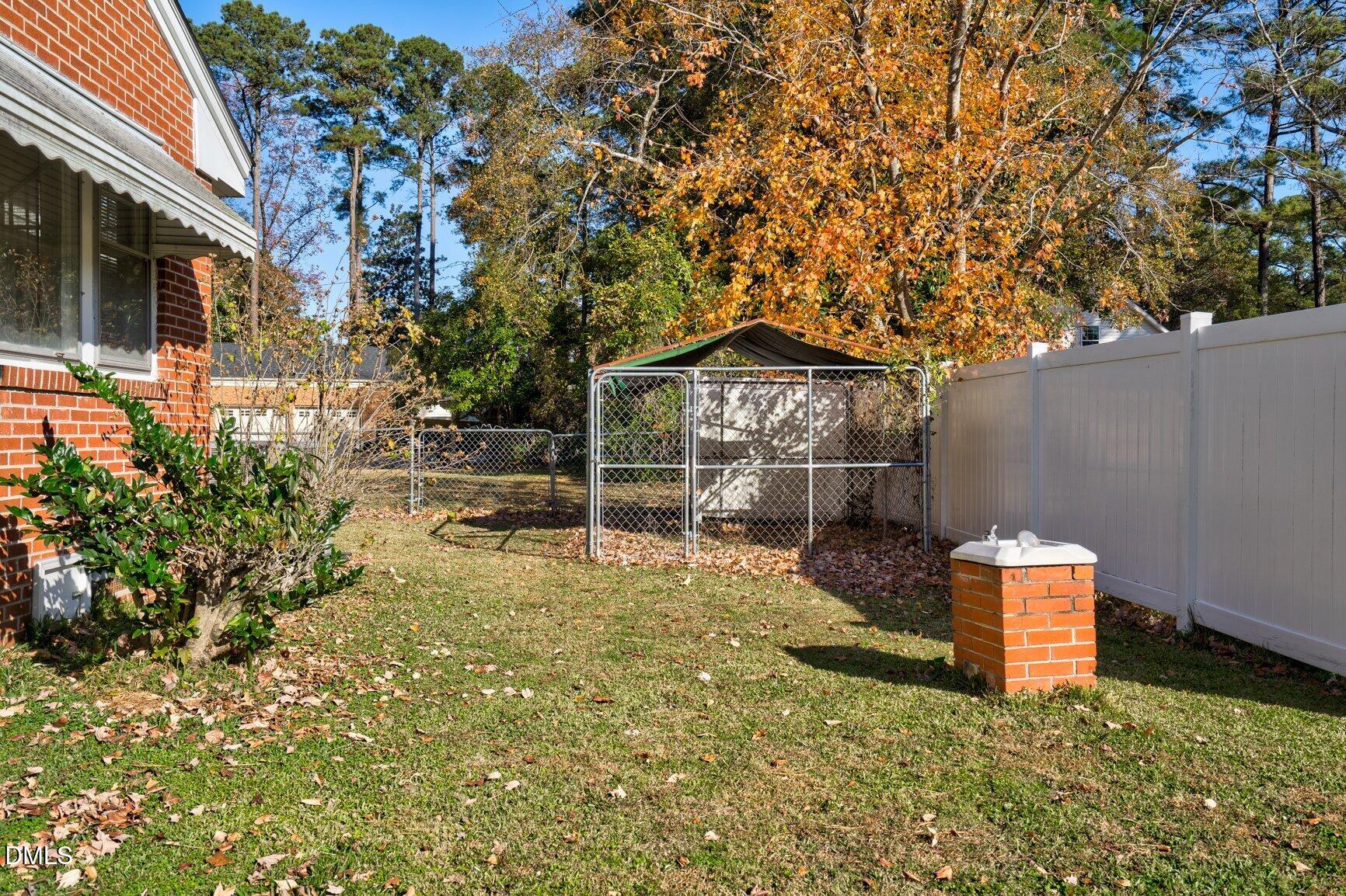 902 Treemont Road Northwest Wilson, NC 27896 - Photo 42 of 43 a backyard of a house with table and chairs