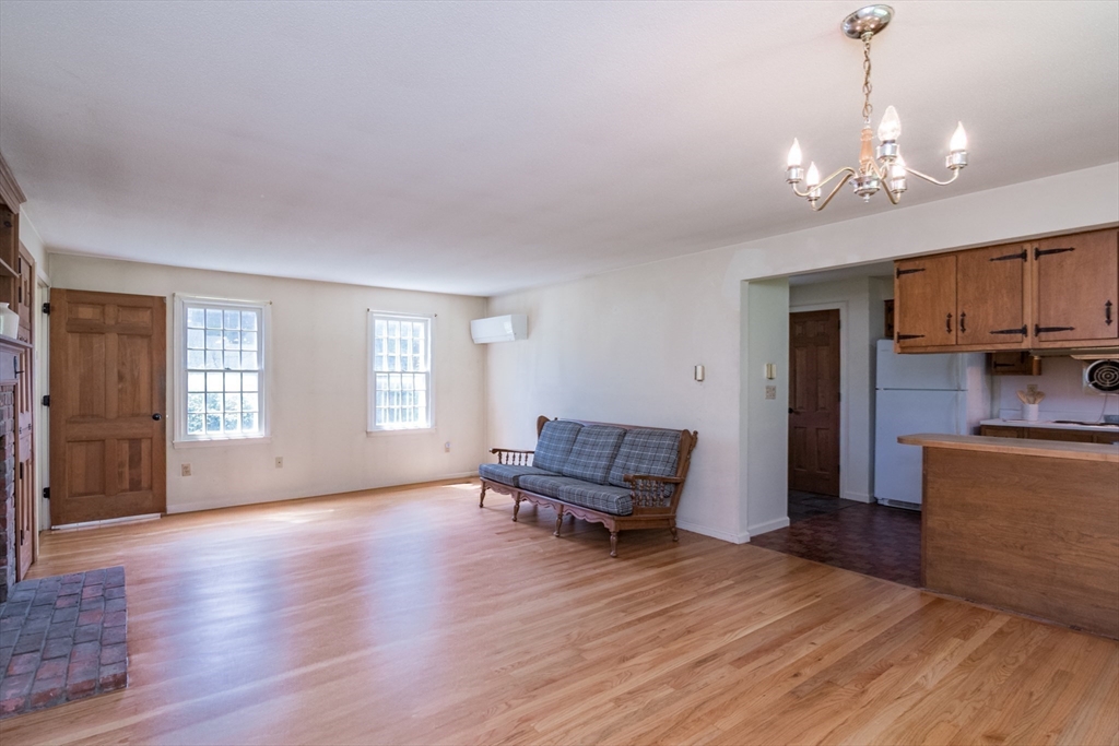 24 South Sunset Avenue Amherst, MA 01002 - Photo 11 of 42 a living room with furniture and a chandelier
