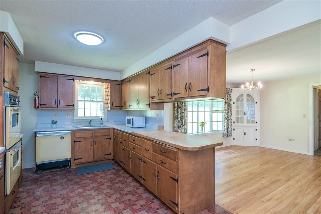24 South Sunset Avenue Amherst, MA 01002 - Photo 12 of 42 a kitchen with a sink stove and cabinets