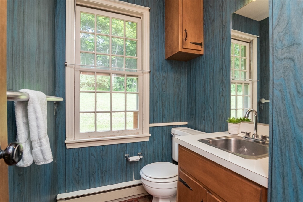 24 South Sunset Avenue Amherst, MA 01002 - Photo 15 of 42 a bathroom with a sink a toilet and window