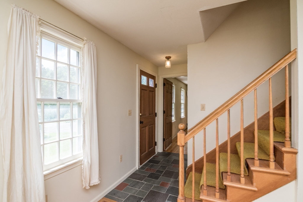 24 South Sunset Avenue Amherst, MA 01002 - Photo 20 of 42 a view of an entryway with wooden floor and windows