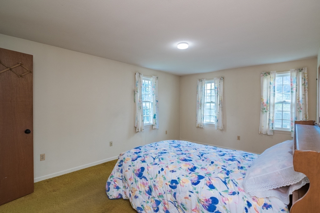 24 South Sunset Avenue Amherst, MA 01002 - Photo 23 of 42 a bedroom with a bed and a window