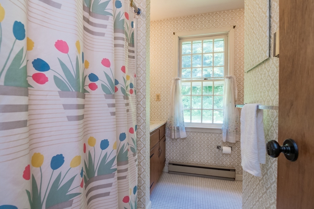 24 South Sunset Avenue Amherst, MA 01002 - Photo 24 of 42 a bathroom with a bathtub and a shower curtain