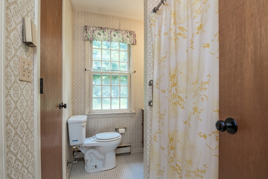24 South Sunset Avenue Amherst, MA 01002 - Photo 29 of 42 a bathroom with a toilet a sink and a shower