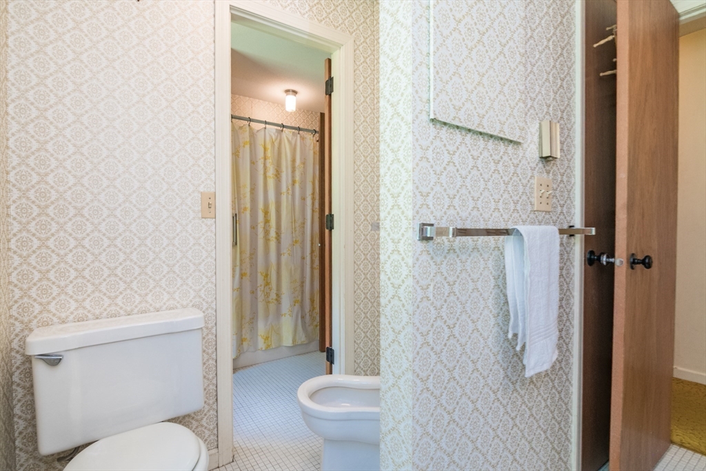 24 South Sunset Avenue Amherst, MA 01002 - Photo 30 of 42 a white toilet sitting next to a bathroom sink