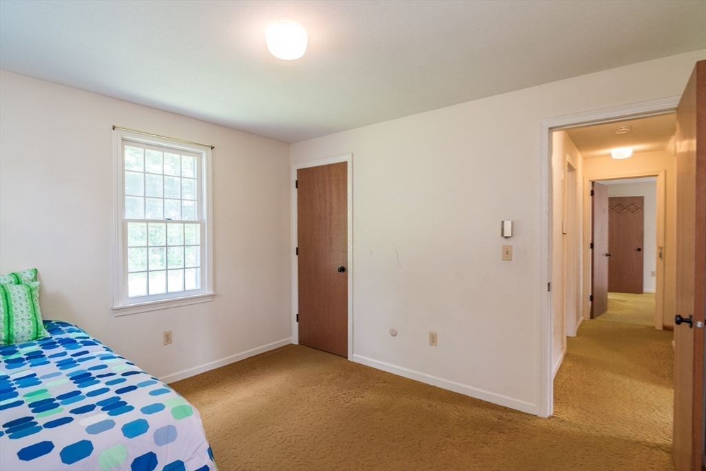 24 South Sunset Avenue Amherst, MA 01002 - Photo 32 of 42 a bedroom with a bed and a window