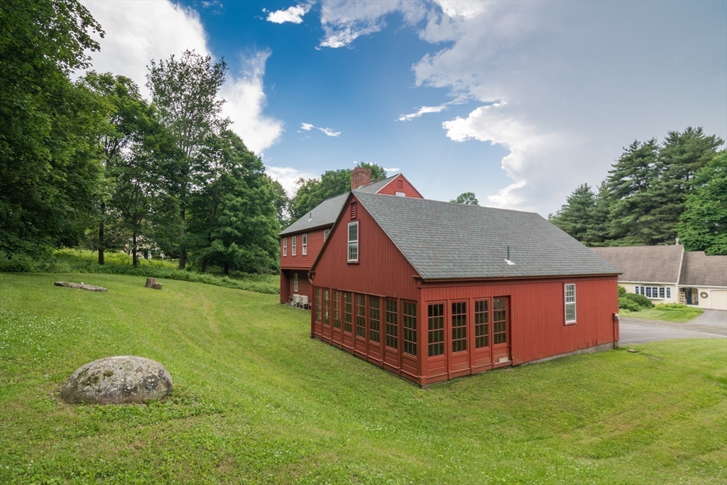 24 South Sunset Avenue Amherst, MA 01002 - Photo 33 of 42 a view of a house with a backyard porch and sitting area