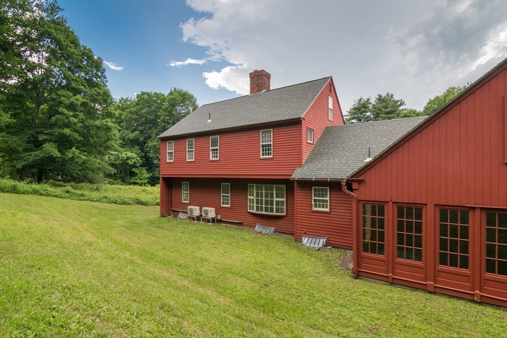24 South Sunset Avenue Amherst, MA 01002 - Photo 34 of 42 a front view of a house with a yard