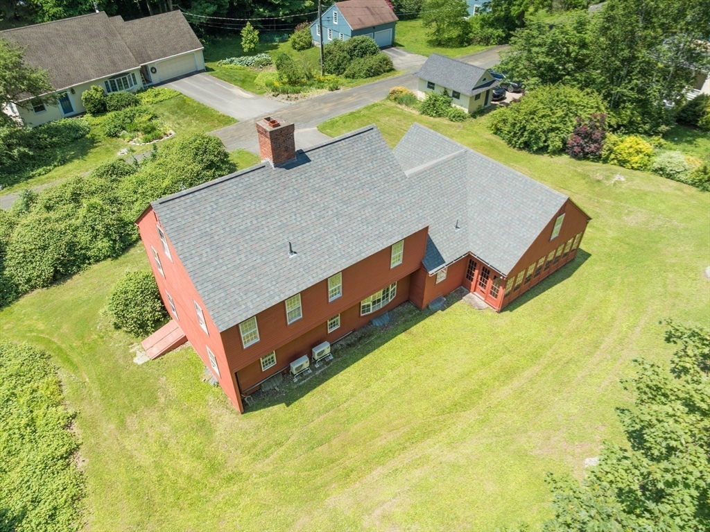 24 South Sunset Avenue Amherst, MA 01002 - Photo 36 of 42 an aerial view of a house with swimming pool and large trees