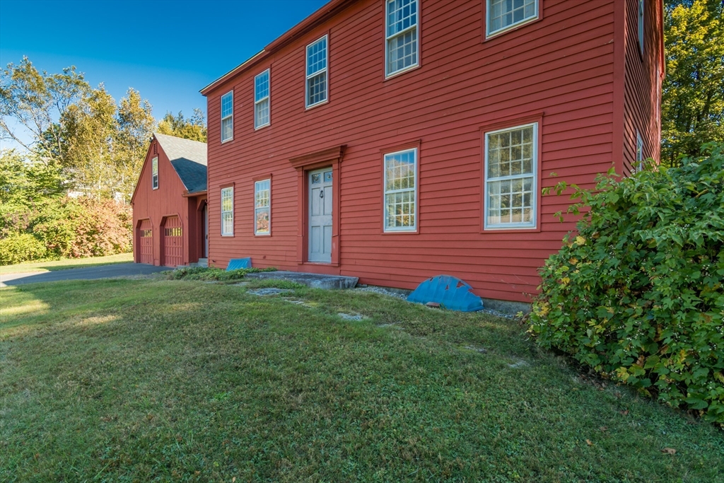 24 South Sunset Avenue Amherst, MA 01002 - Photo 5 of 42 a view of a brick house with a yard