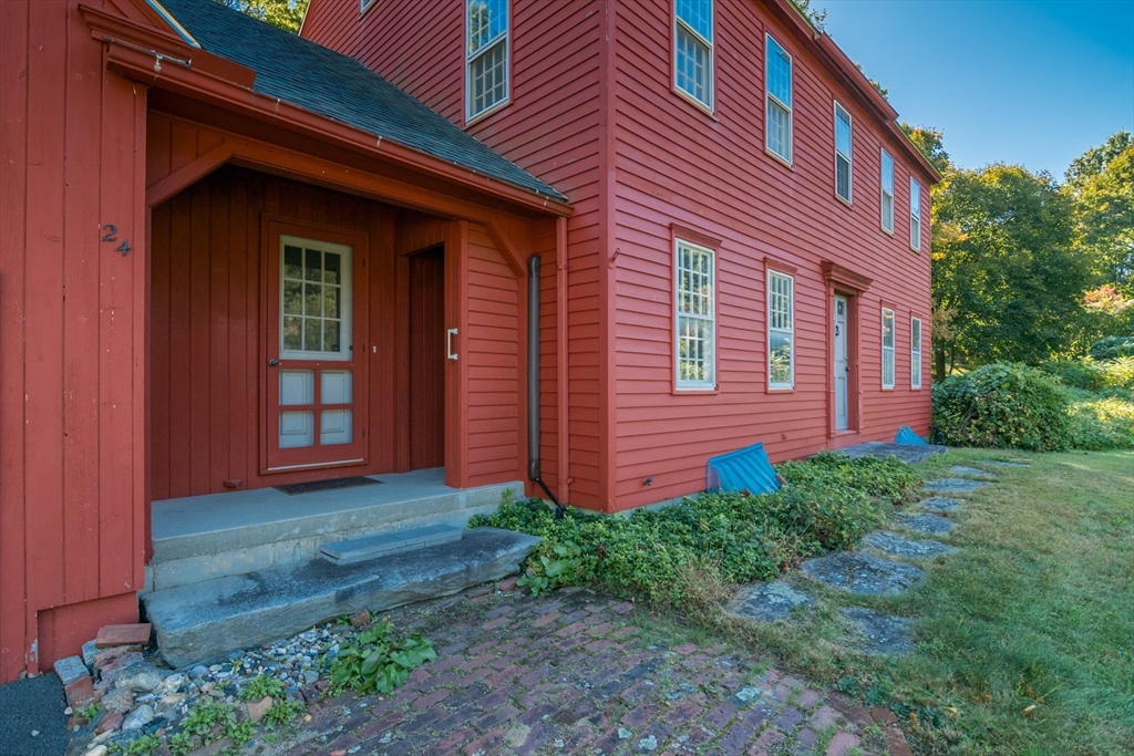 24 South Sunset Avenue Amherst, MA 01002 - Photo 6 of 42 a view of a brick house with a yard